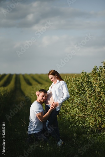 Portrait of lovely future parents during sunset
