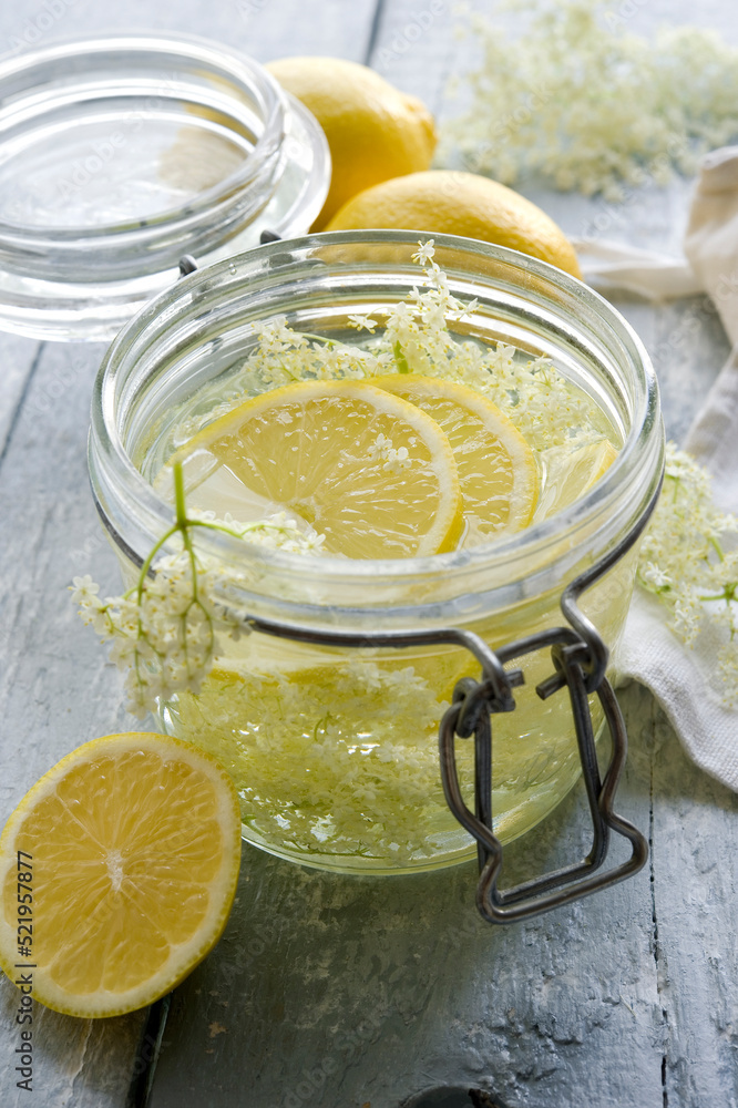 Studio shot of elderflower syrup in mason jar Studio shot of elderflower syrup in mason jar