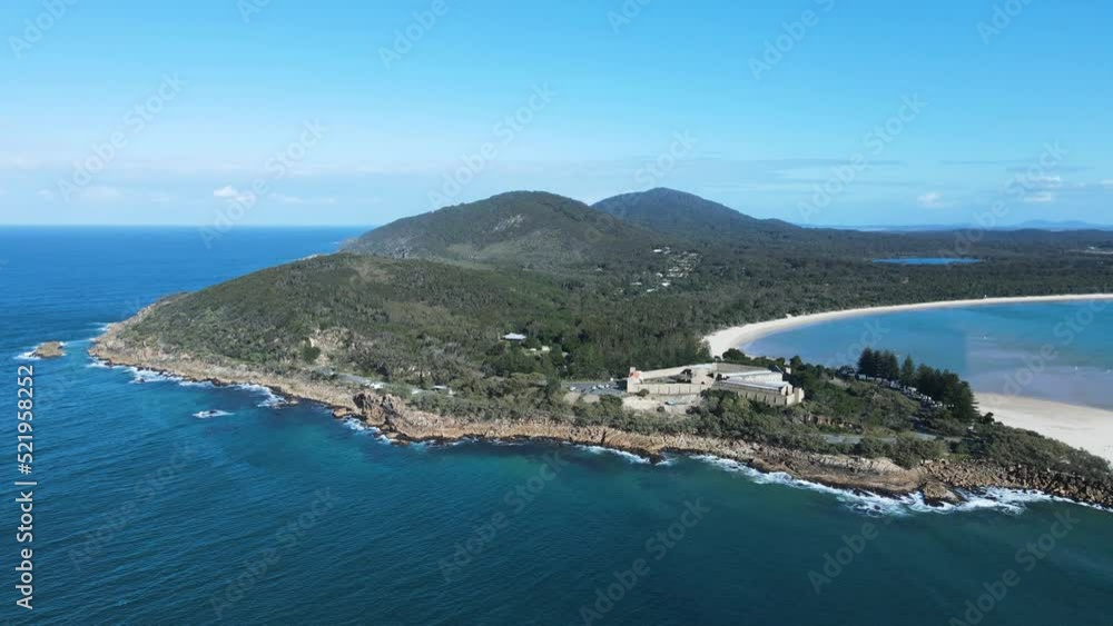 Historic ruins of a gaol built on a coastal peninsular with scenic backdrop. Panoramic drone view Historic ruins of a gaol built on a coastal peninsular with scenic backdrop. Panoramic drone view