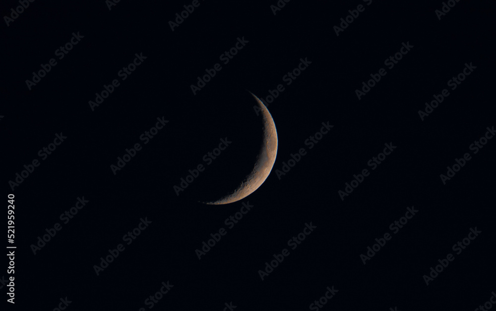 a close-up of a waning crescent moon a close-up of a waning crescent moon