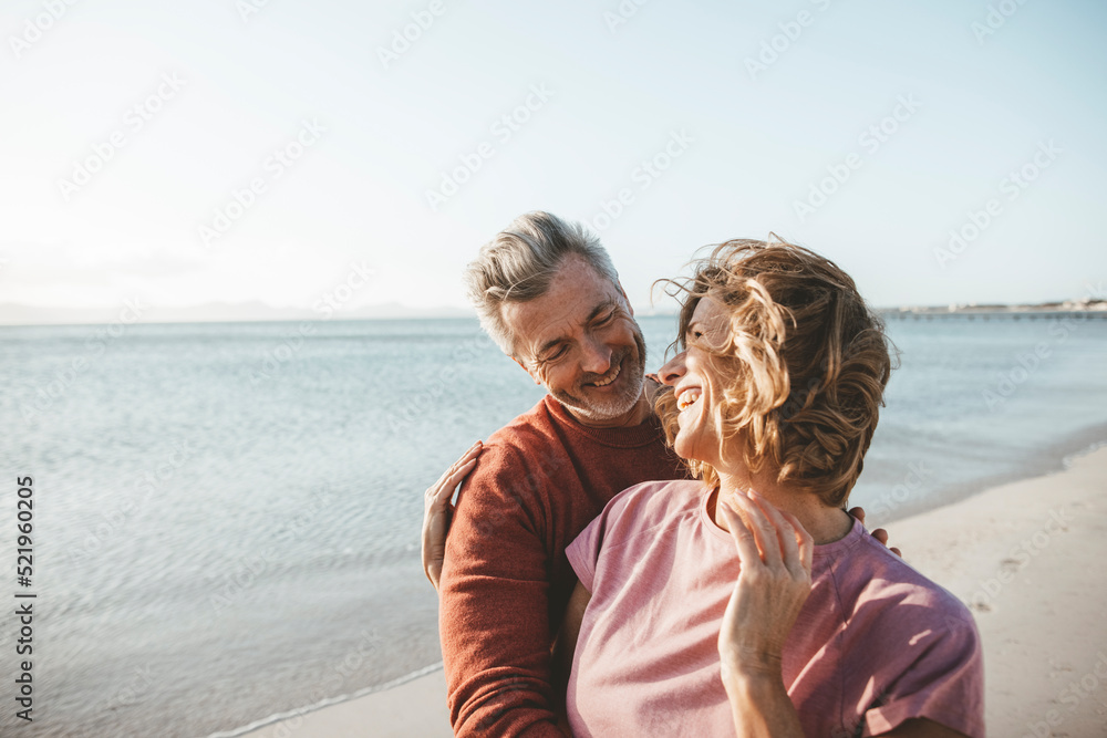 Happy blond woman with man enjoying vacation at beach Happy blond woman with man enjoying vacation at beach