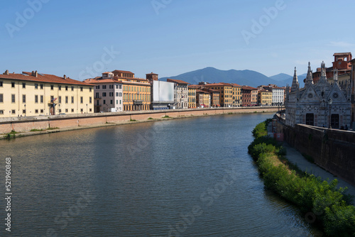 Italy, Tuscany, Pisa, Arno river canal with residential buildings and Santa Maria Della Spina church photo