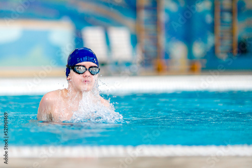 Boy in the swimming pool.  Training sessions on the water.