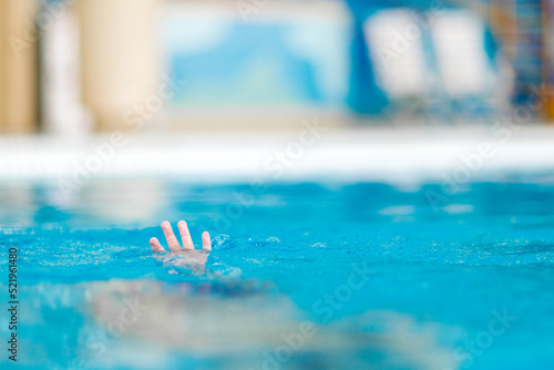 Obraz na plátně The child is drowning in the swimming pool.  Danger