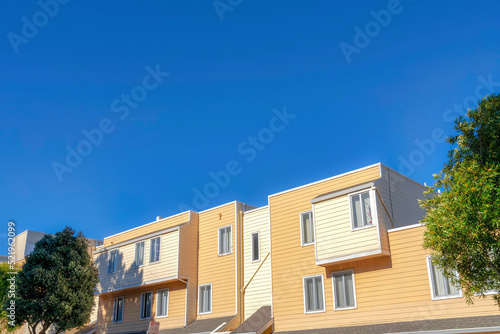 Apartment building with flat and asphalt composite shingle canopy roof in San Francisco, CA