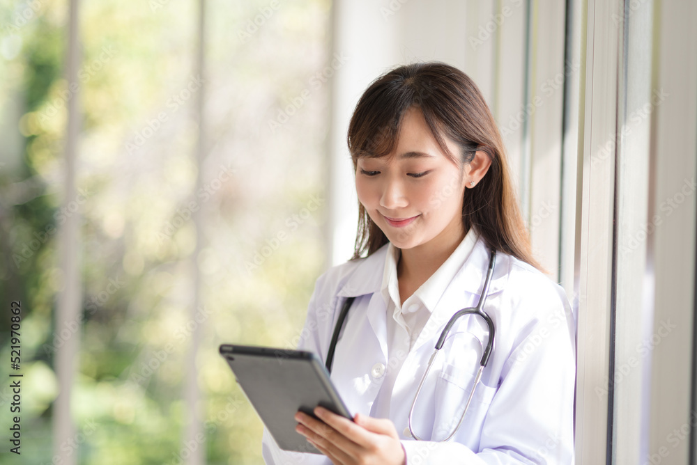 Asian doctor woman portrait in professional uniform standing with smile and confidence. Asian doctor woman portrait in professional uniform standing with smile and confidence.