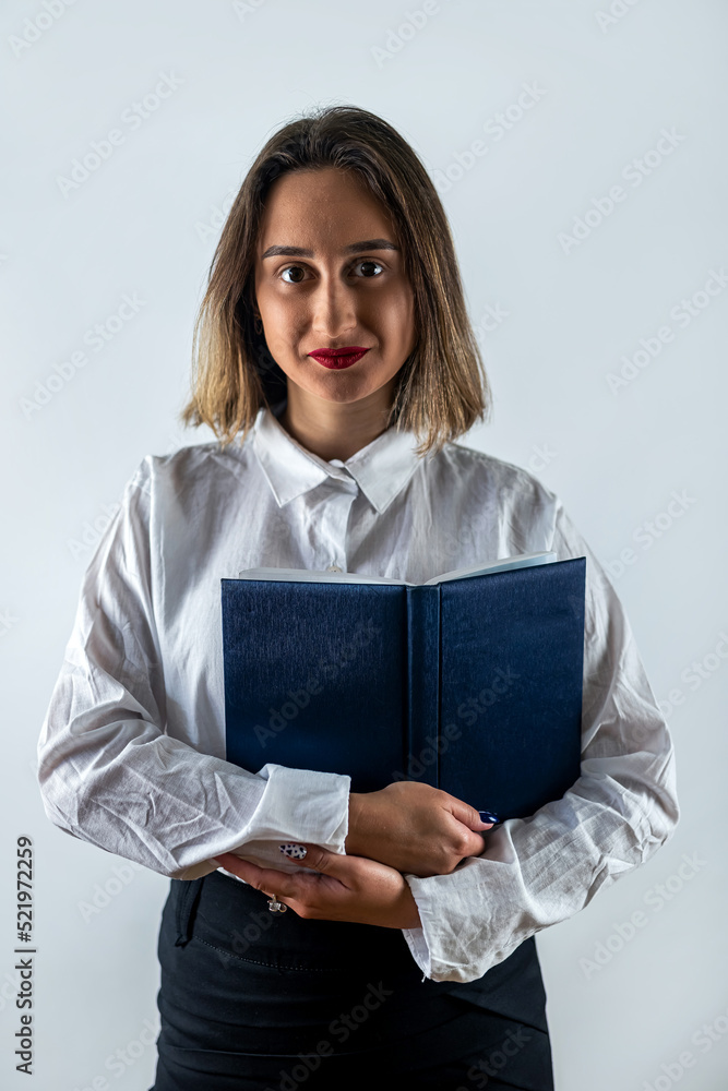 beautiful young business lady standing with documents isolated on white background. beautiful young business lady standing with documents isolated on white background.