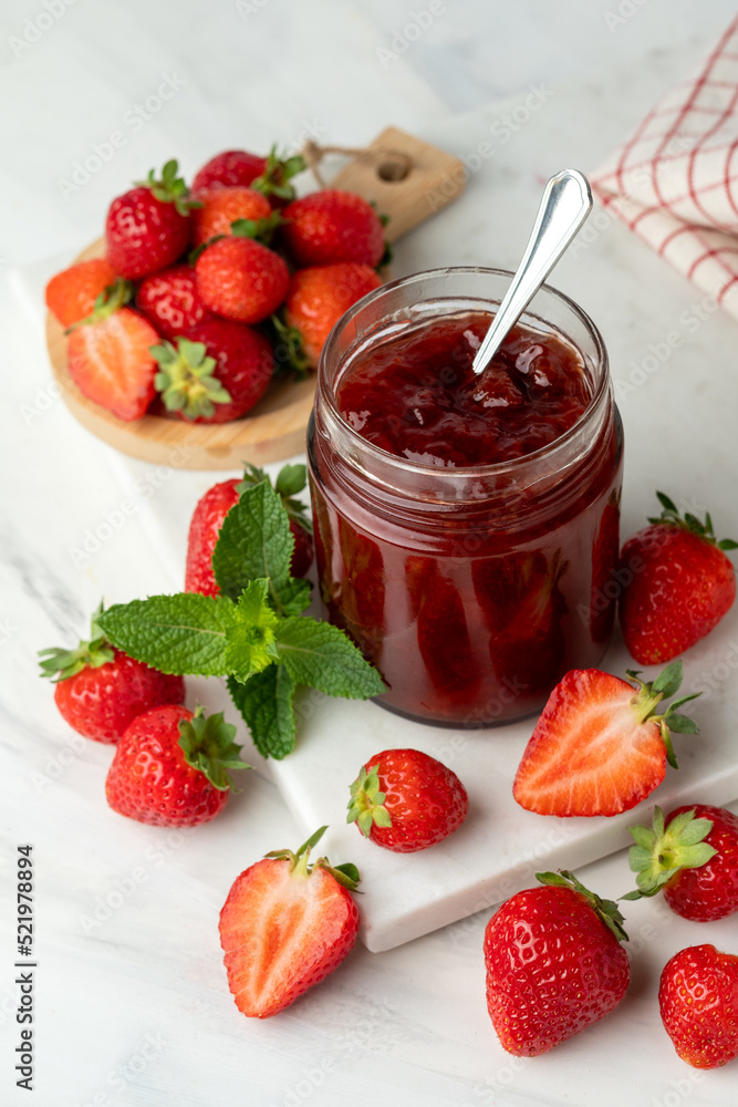 strawberry jam in glass jar and fresh strawberries strawberry jam in glass jar and fresh strawberries