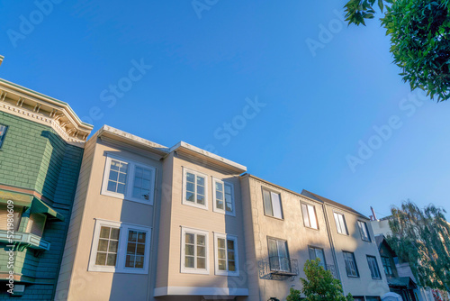 Townhouses in a low angle view at the neighborhood of San Francisco, California © Jason