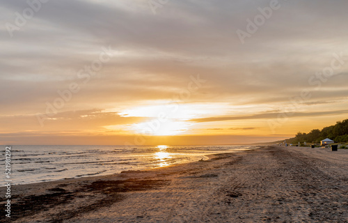 Sunset on sandy beach of the Baltic Sea