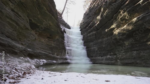 Wide shot of the frozen waterfall at the French Canyon of Starved Rock State Park. photo
