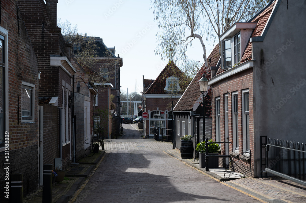 Old streets and houses of historival Dutch town Enkhuizen, Horth-Holland, Netherlands