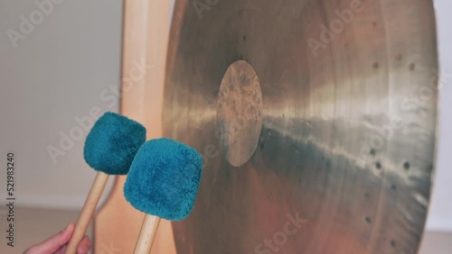 Playing gong during a yoga course