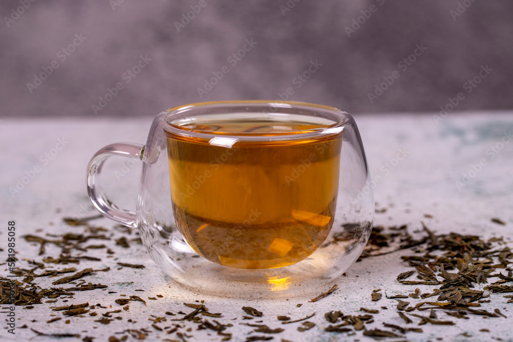 Green tea. Green tea on stone background. Healthy drinks. Herbal tea concept. close up Green tea. Green tea on stone background. Healthy drinks. Herbal tea concept. close up