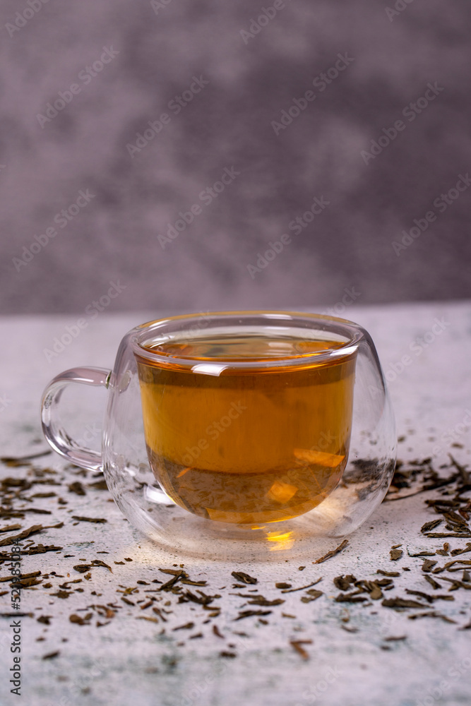 Green tea. Green tea on stone background. Healthy drinks. Herbal tea concept. close up Green tea. Green tea on stone background. Healthy drinks. Herbal tea concept. close up
