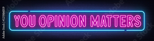 You opinion matters neon sign on brick wall background
