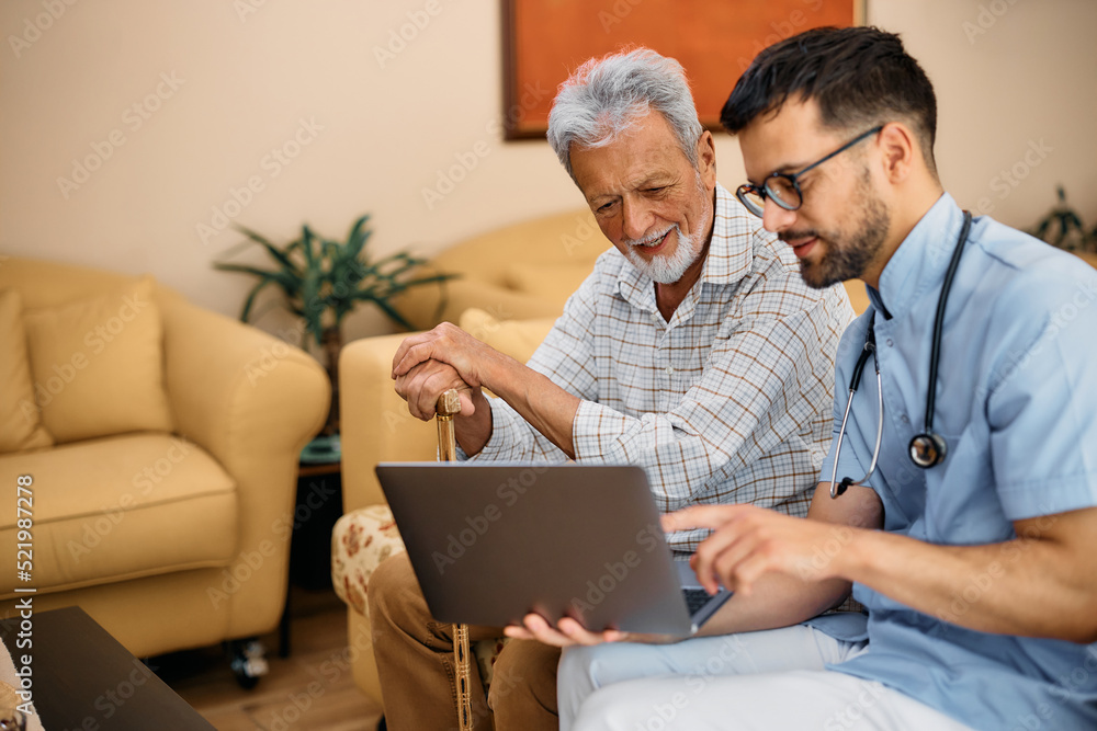 Male nurse assisting senior woman in using laptop at nursing home. Male nurse assisting senior woman in using laptop at nursing home.