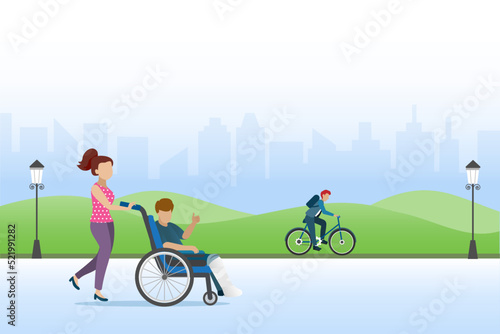 Woman help man with broken leg in plaster cast on wheelchair to public park for relaxation.