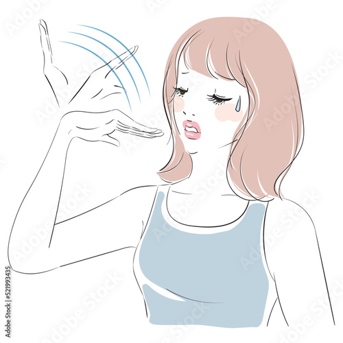 暑がるミディアムヘアの女性
