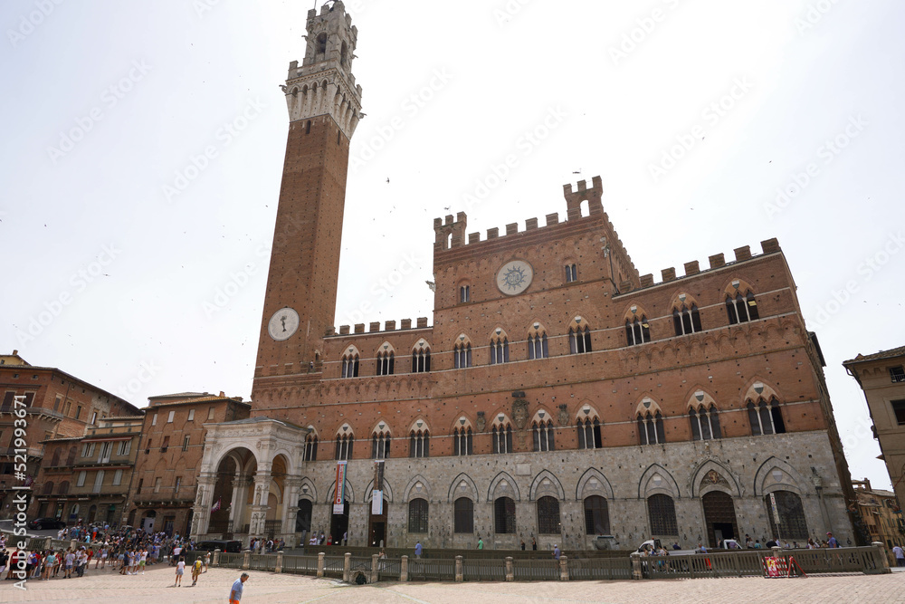 Palazzo Pubblico palace and its Torre del Mangia tower in the historic center of Siena, Tuscany, Italy