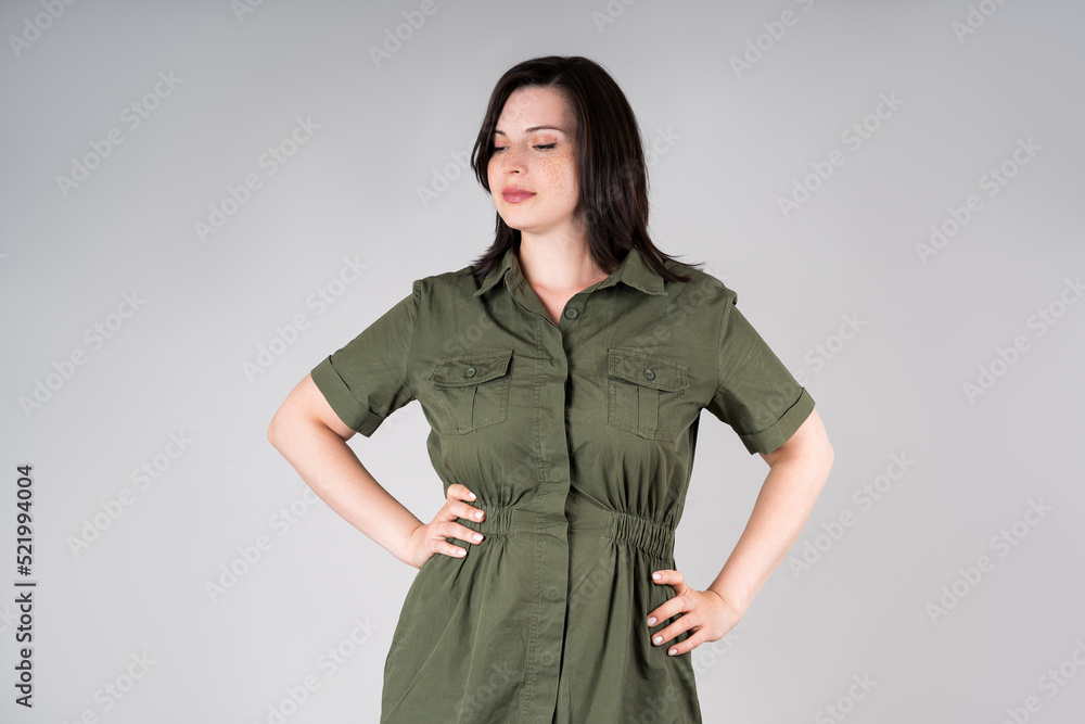 Plus size model in casual clothes, fat woman on gray background, overweight female body Plus size model in casual clothes, fat woman on gray background, overweight female body