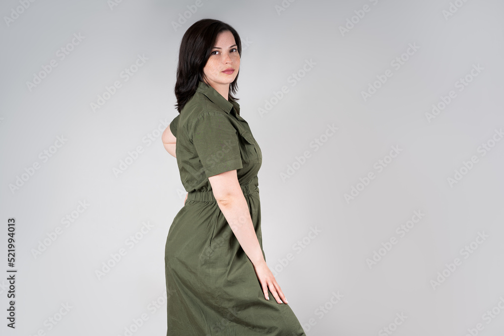 Plus size model in casual clothes, fat woman on gray background, overweight female body Plus size model in casual clothes, fat woman on gray background, overweight female body