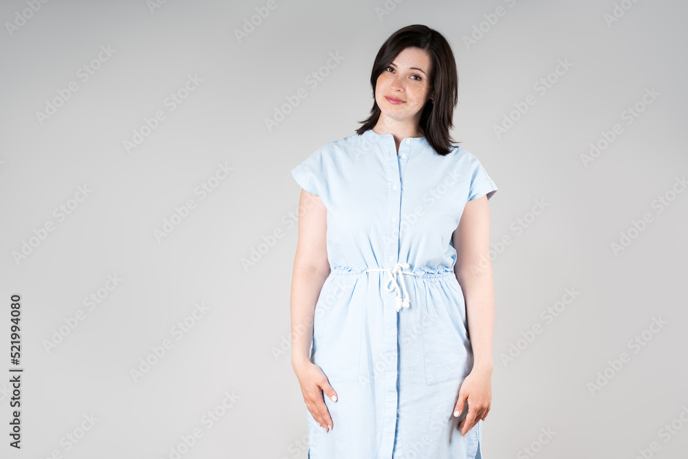 Cute plus size model in casual clothes, fat woman on gray background, overweight female body Cute plus size model in casual clothes, fat woman on gray background, overweight female body