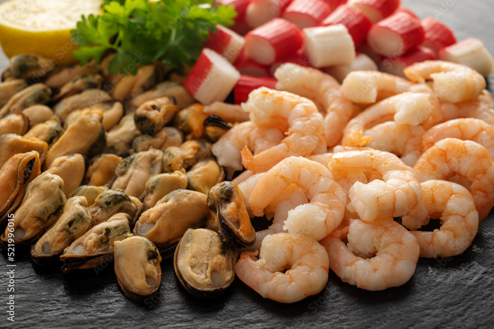 Seafood charcuterie plate board with shrimps, dark background, top view Seafood charcuterie plate board with shrimps, dark background, top view