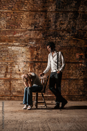 Couple Breakdown. A moment of despair for a woman deceived by her partner. From a series of images with the same models.