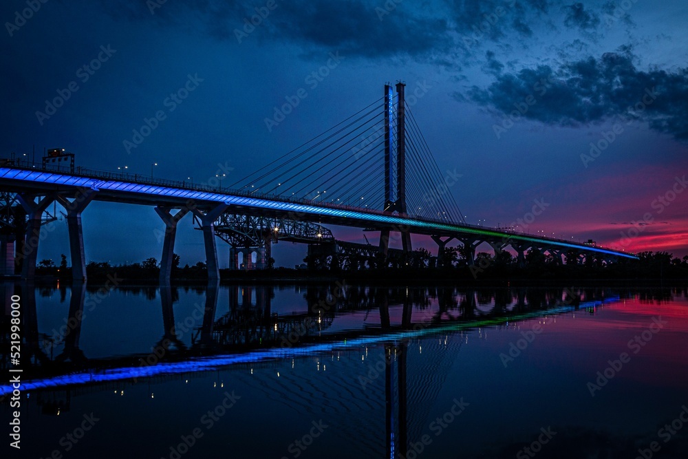 Fototapeta premium Samuel De Champlain bridge illuminated in Brossard, Quebec, Canada at sunset
