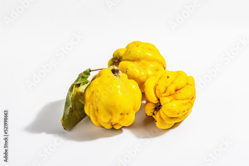 Ripe whole quince isolated on white background