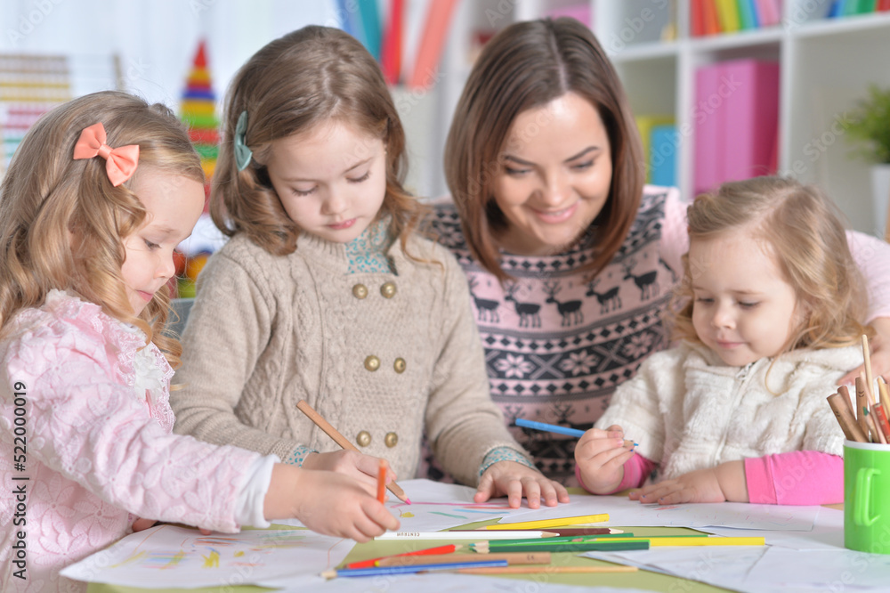 Mother and girls drawing Mother and girls drawing