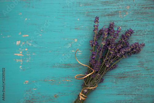 Lavender flowers on vintage turquoise wooden background