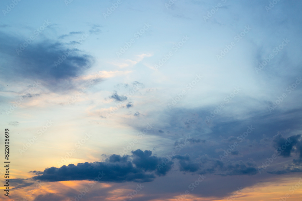 Blurred background. Blue sky and white fluffy clouds.