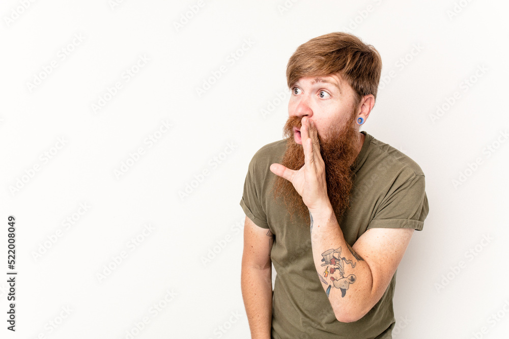 Young caucasian red-haired man isolated on white background being shocked because of something she has seen. Young caucasian red-haired man isolated on white background being shocked because of something she has seen.