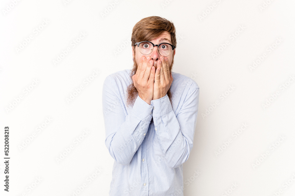 Young caucasian red-haired man isolated on white background shocked, covering mouth with hands, anxious to discover something new. Young caucasian red-haired man isolated on white background shocked, covering mouth with hands, anxious to discover something new.