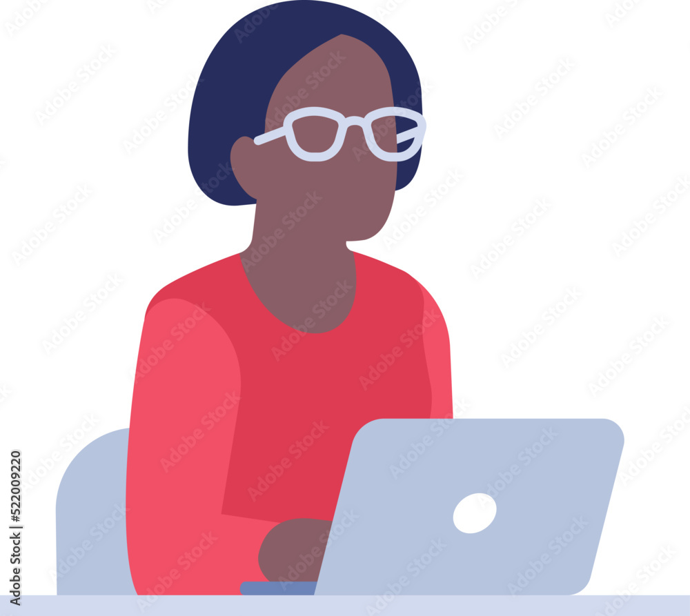 Black woman working on laptop. Person sitting at desk