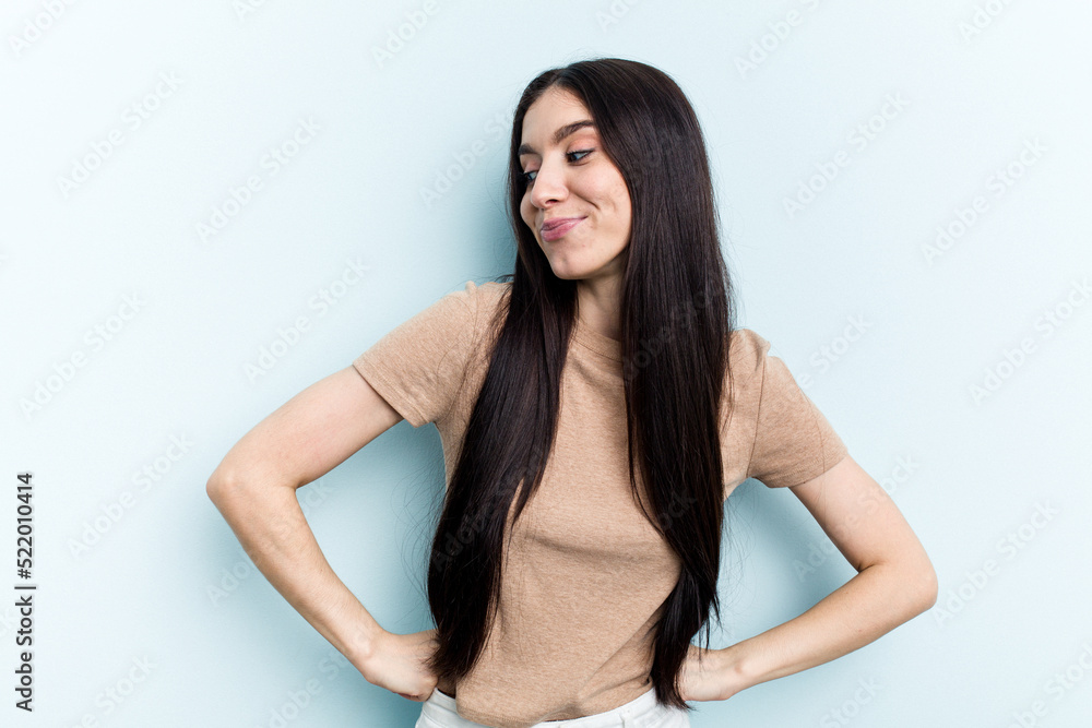 Young caucasian woman isolated on blue background dreaming of achieving goals and purposes Young caucasian woman isolated on blue background dreaming of achieving goals and purposes
