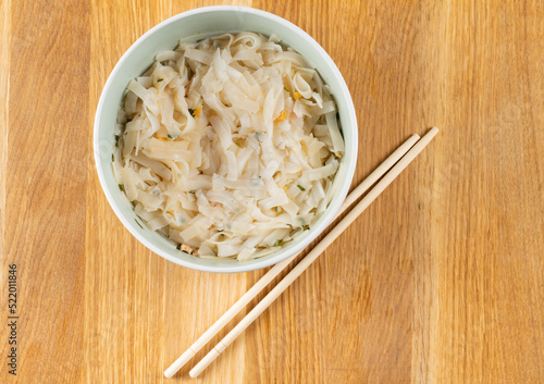 bowl of noodle with sticks from top