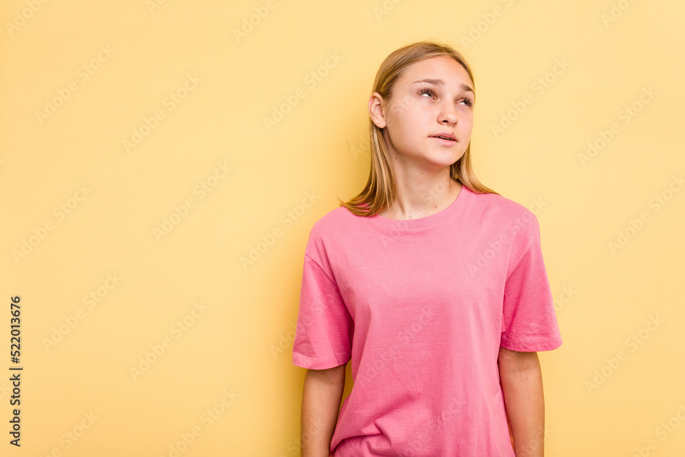 Young caucasian girl isolated on yellow background shouting very angry, rage concept, frustrated. Young caucasian girl isolated on yellow background shouting very angry, rage concept, frustrated.