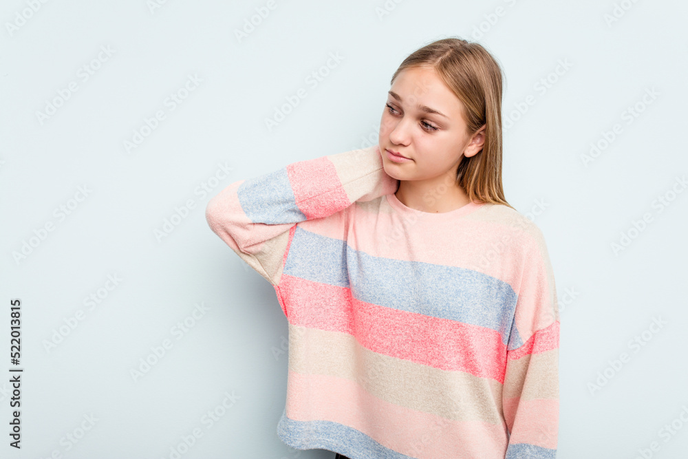 Young caucasian girl isolated on blue background touching back of head, thinking and making a choice. Young caucasian girl isolated on blue background touching back of head, thinking and making a choice.