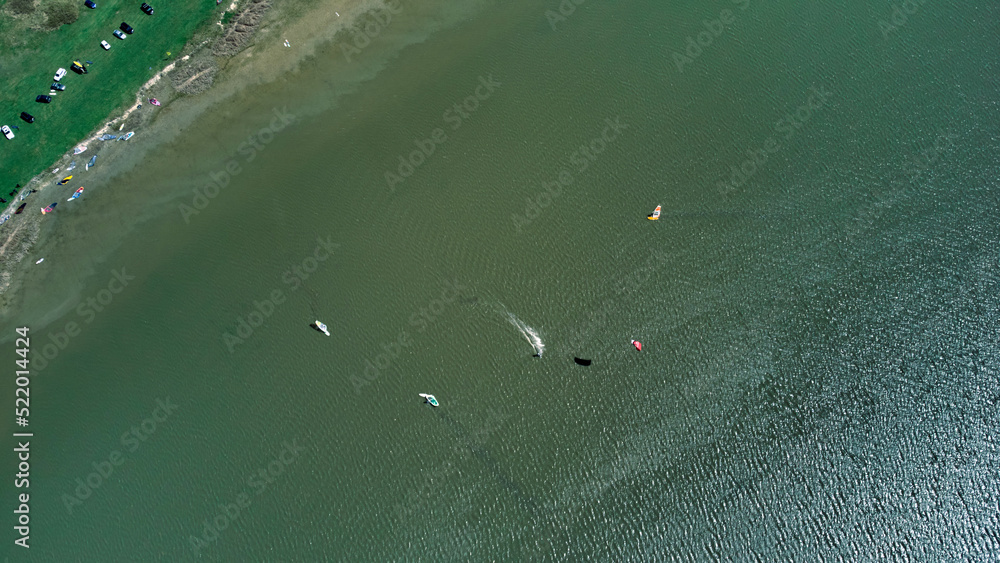 Windsurfing camp on a lake shore. Windsurfing camp on a lake shore.