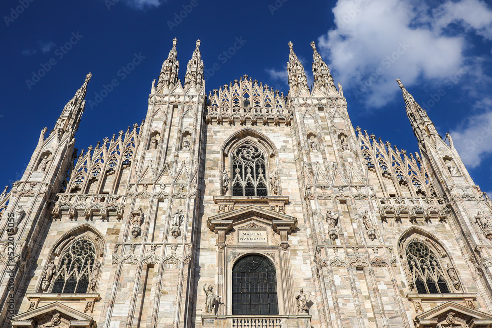 Front View of Milan Cathedral in Northern Italy. Below View of Metropolitan Cathedral-Basilica of the Nativity of Saint Mary in Lombardy with Blue Sky.