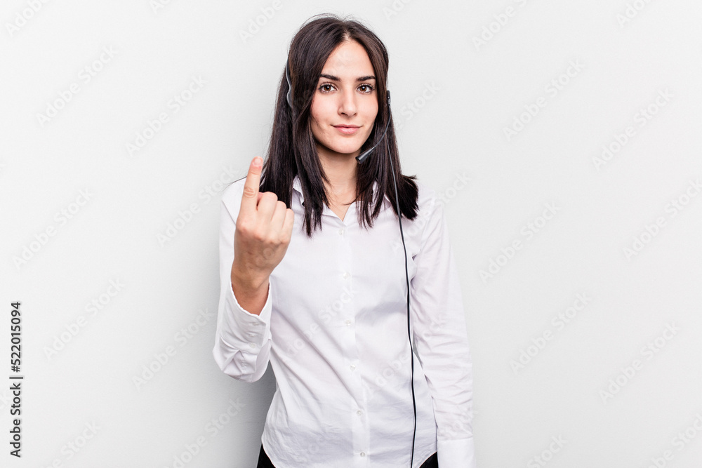 Telemarketer caucasian woman working with a headset isolated on white background pointing with finger at you as if inviting come closer. Telemarketer caucasian woman working with a headset isolated on white background pointing with finger at you as if inviting come closer.
