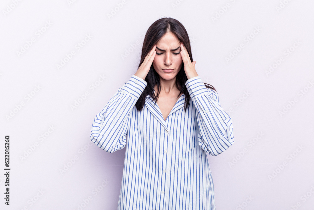 Young caucasian woman isolated on pink background touching temples and having headache. Young caucasian woman isolated on pink background touching temples and having headache.