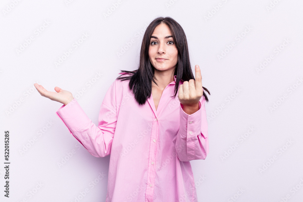 Young caucasian woman isolated on pink background showing that she has no money. Young caucasian woman isolated on pink background showing that she has no money.