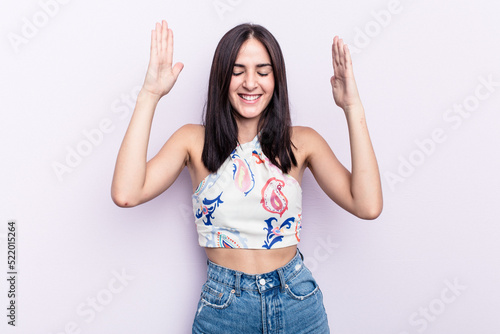 Young caucasian woman isolated on pink background joyful laughing a lot. Happiness concept.