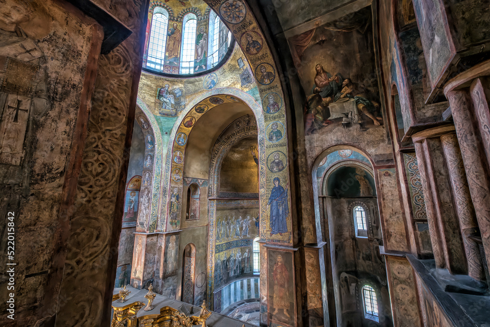 Interior of the St. Sophia Cathedral with mosaic, painting frescoes on the wall and the golden altar. Kyiv, Ukraine