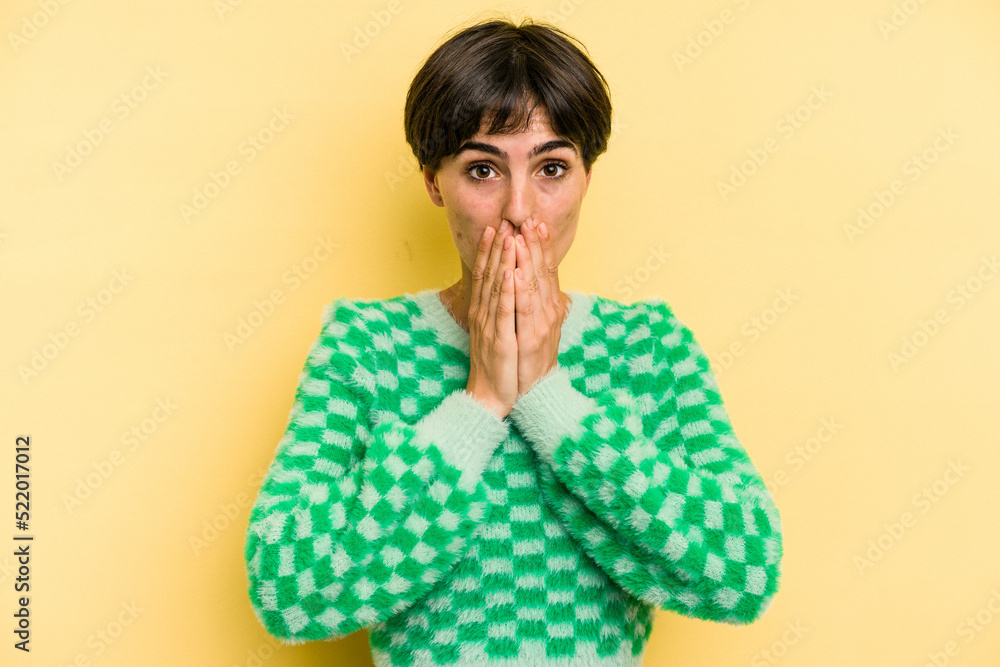 Young caucasian woman with a short hair cut isolated shocked covering mouth with hands. Young caucasian woman with a short hair cut isolated shocked covering mouth with hands.