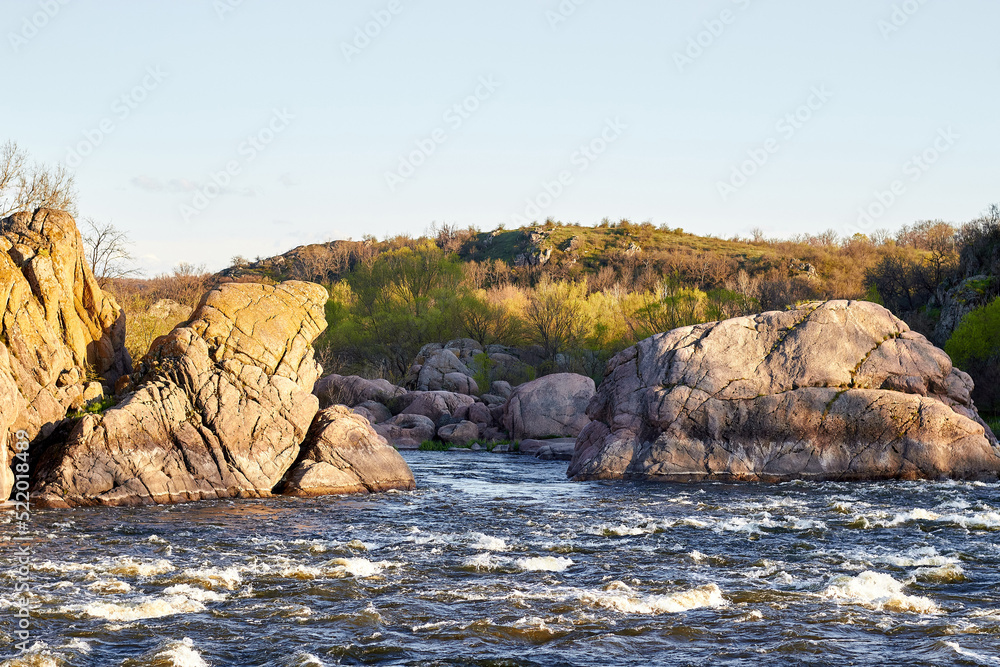 Rocky fast river. Running water, flowing with rapids, landscape